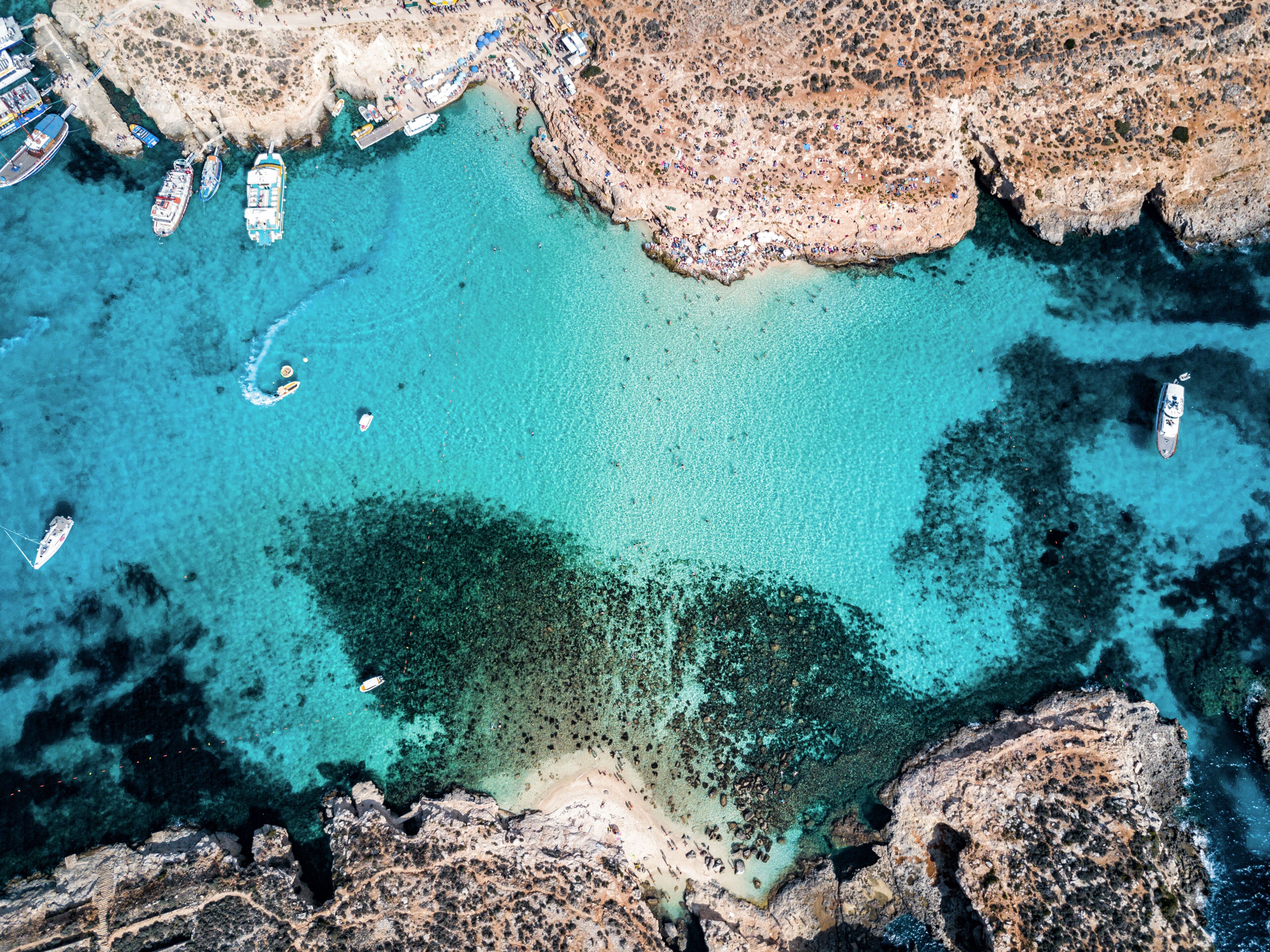 Aerial drone photo - The famous Blue Lagoon in the Mediterranean Sea.  Comino Island, Malta.     