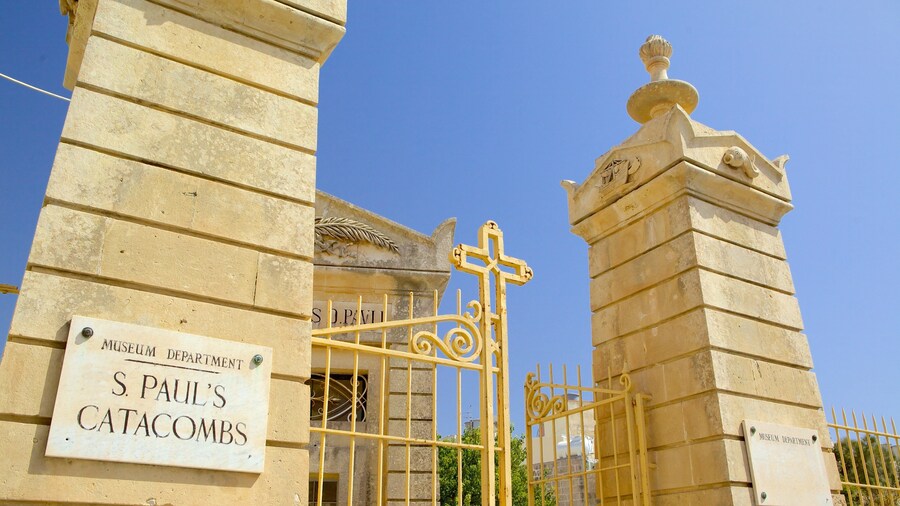 Catacombs of St. Paul and St. Agatha\'s Crypt featuring religious aspects, signage and a cemetery