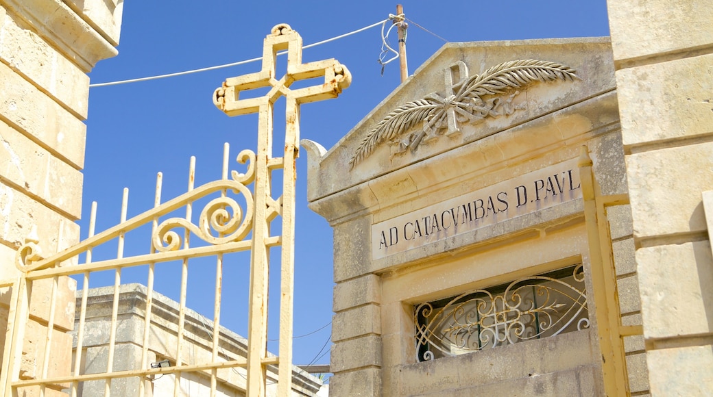Catacombs of St. Paul and St. Agatha\'s Crypt featuring a cemetery, religious elements and heritage architecture