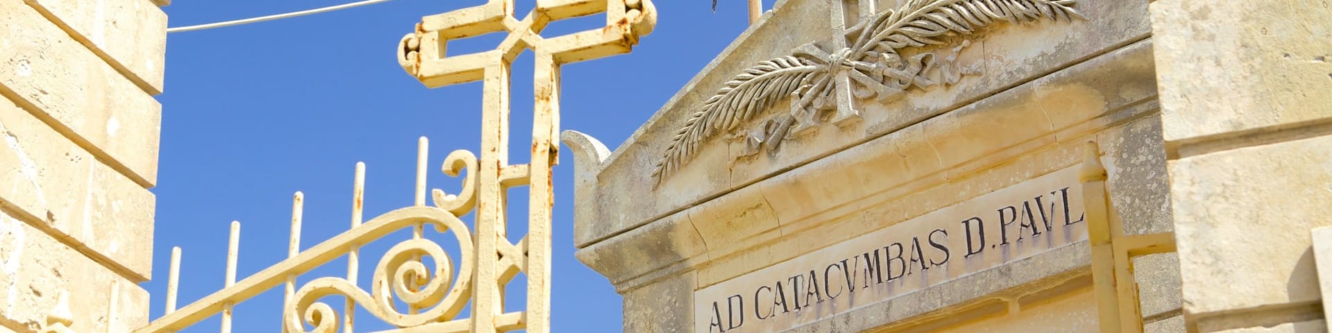 Catacombs of St. Paul and St. Agatha\'s Crypt featuring a cemetery, religious elements and heritage architecture