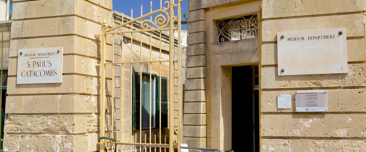 Catacombs of St. Paul and St. Agatha\'s Crypt featuring a cemetery and heritage architecture