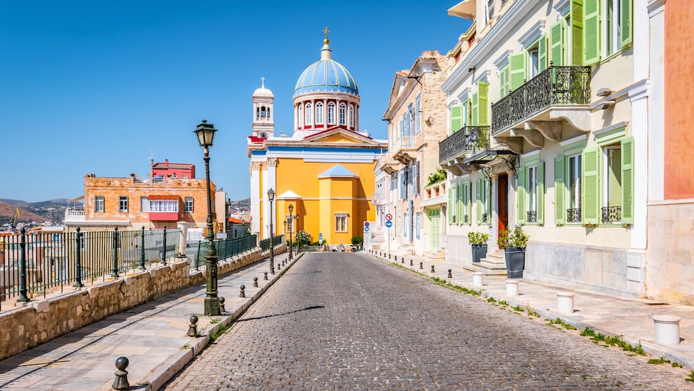Street with colorful buildings in town center of Ermoupoli, Syros, Greece.
