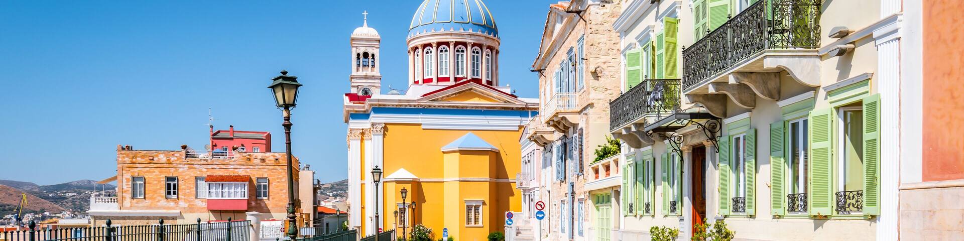 Street with colorful buildings in town center of Ermoupoli, Syros, Greece.