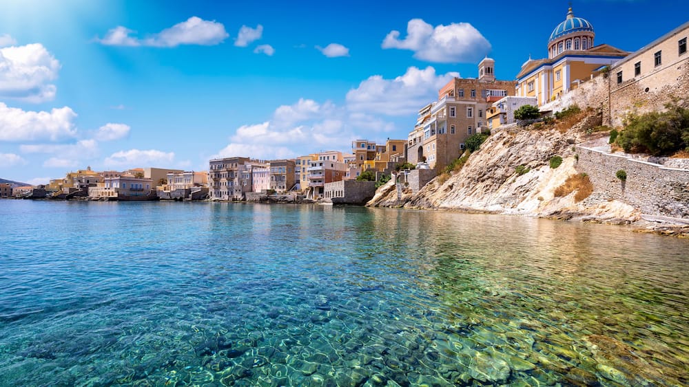 The emerald sea at the Vaporia district, city of Ermoupoli at Syros island, Cyclades, Greece, during a sunny summer day