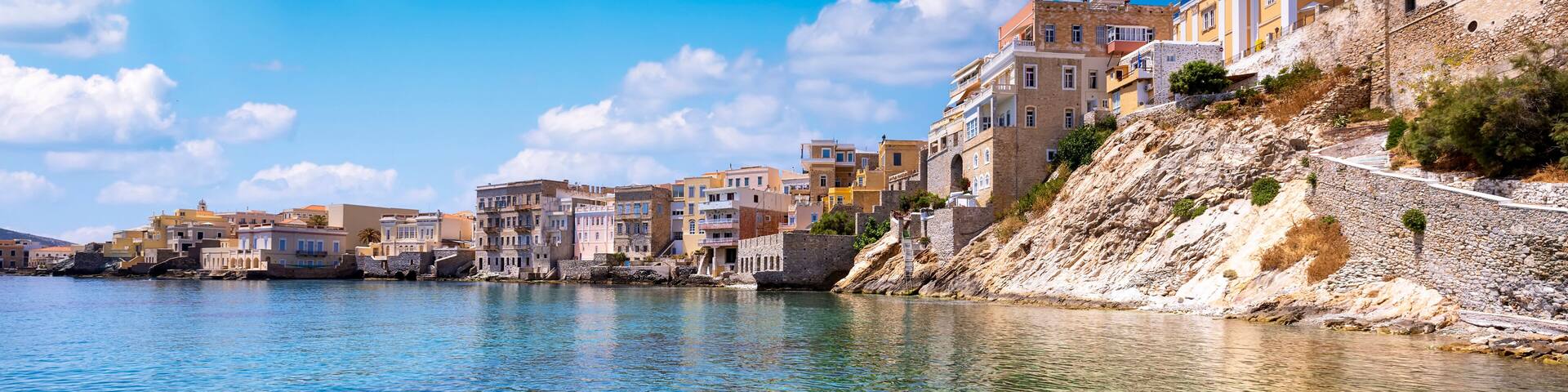 The emerald sea at the Vaporia district, city of Ermoupoli at Syros island, Cyclades, Greece, during a sunny summer day