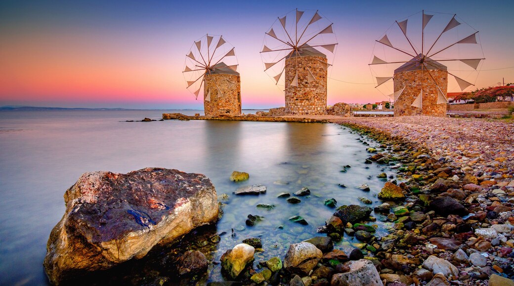 Old windmills by the beach, Chios island, Greece.