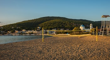 Volleyball tower and net on sandy beach