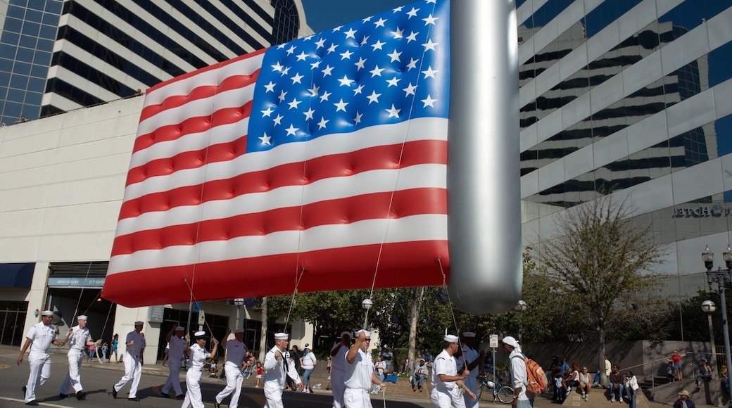 Downtown Jacksonville featuring a festival and military items as well as a large group of people