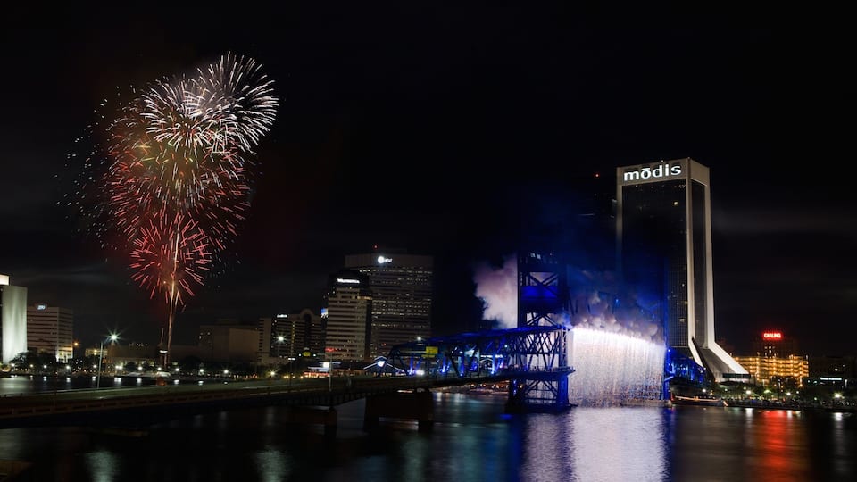 Downtown Jacksonville which includes night scenes, a city and a river or creek