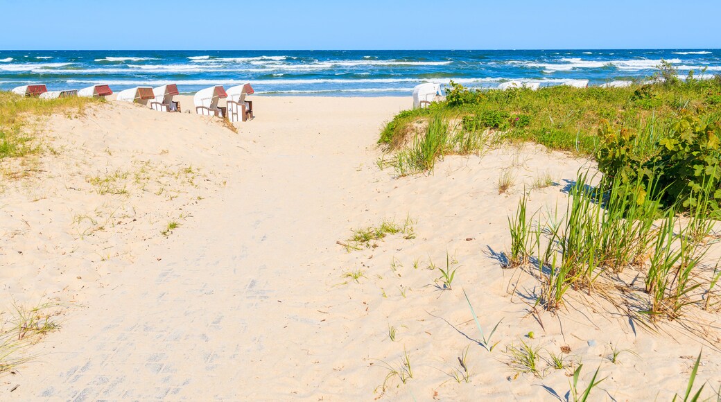 Traditional wicker chairs on sandy beach in Baabe town, Ruegen island, Baltic Sea, Germany