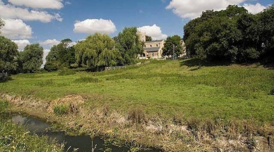 Holywell Church View of the church taken from the flood plain, looking across the brook that runs in "front" of Holywell into the river Great Ouse.