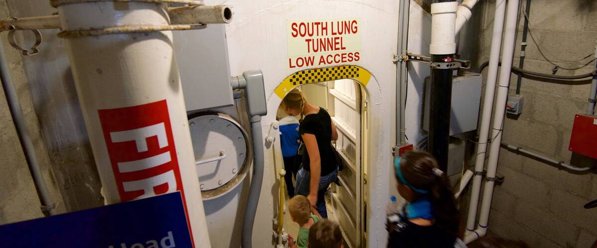 Biosphere 2 which includes signage and interior views as well as a small group of people
