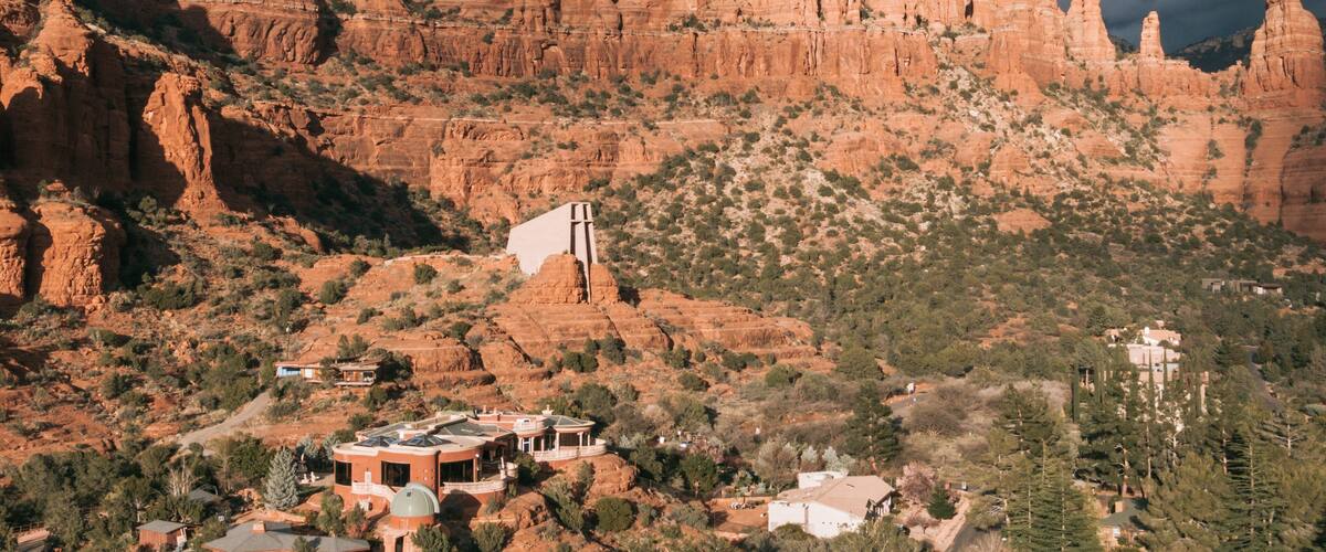 Chapel of the Holy Cross which includes a gorge or canyon and landscape views