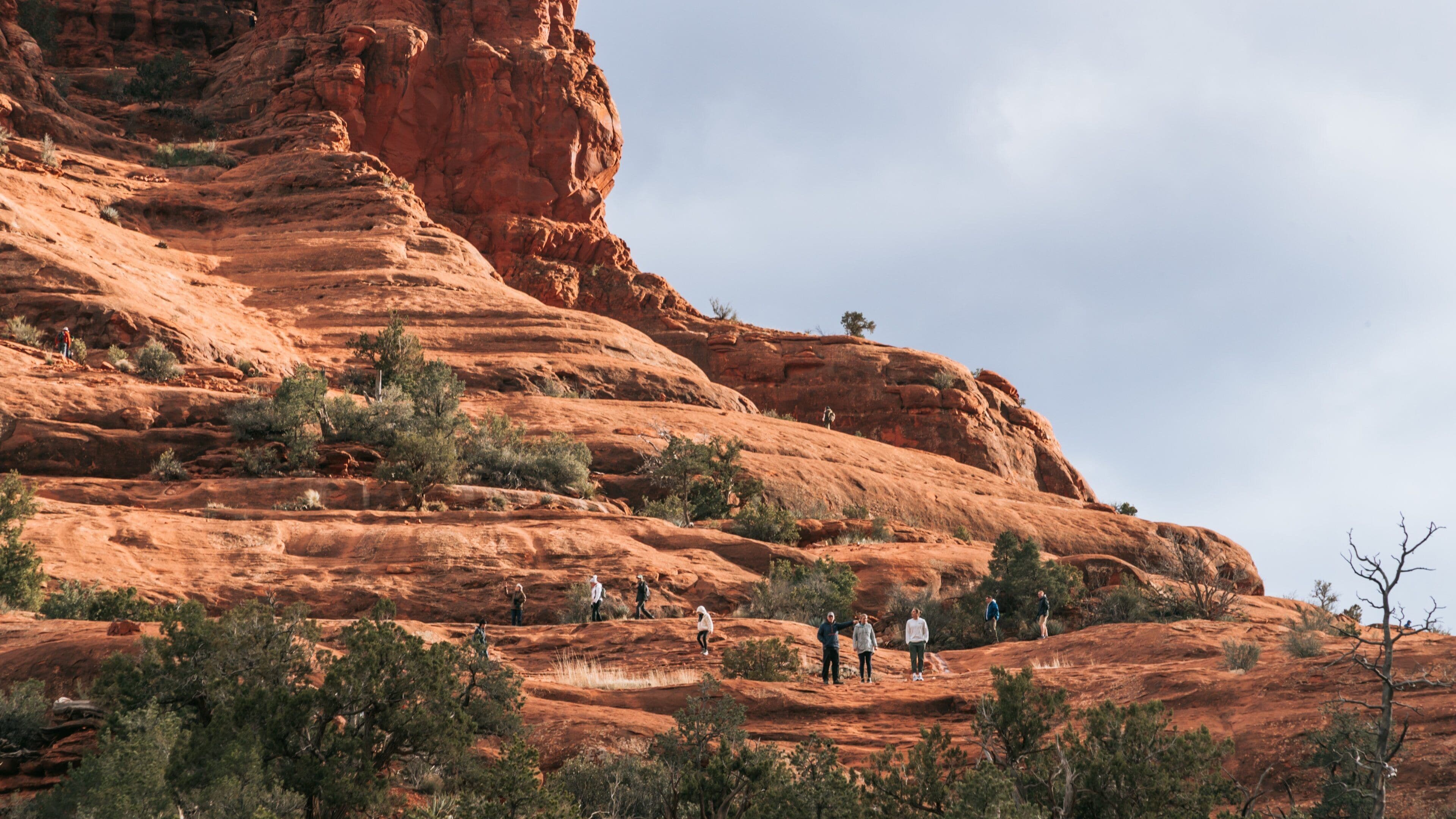 Bell Rock showing a gorge or canyon as well as a small group of people