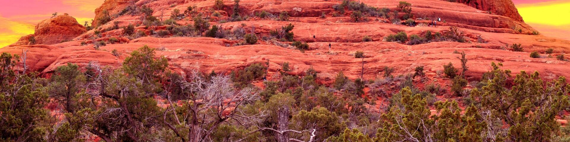 A red rock formation with a clear sky.