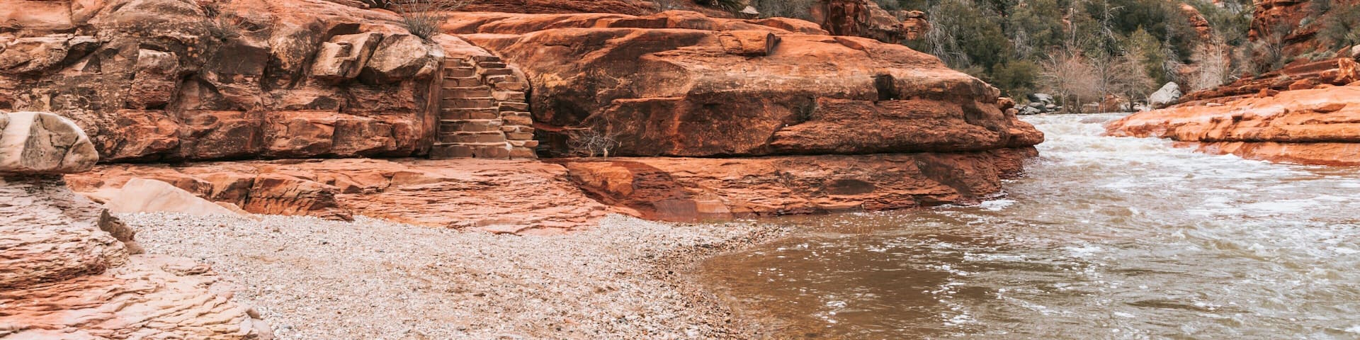 Slide Rock State Park featuring a river or creek and a gorge or canyon