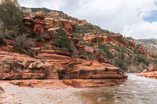 Slide Rock State Park featuring a river or creek and a gorge or canyon