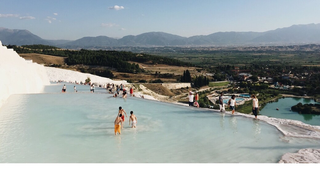 The Pamukkale (meaning Cotton Castle) pools in Turkey are made of travertine terraces formed by calcium carbonate deposits. Near the ancient city of Hierapolis, people have been bathing in the mineral-rich thermal pools for thousands of years. There are 17 pools of varying temperatures. No shoes allowed! #turkey #thermalpool