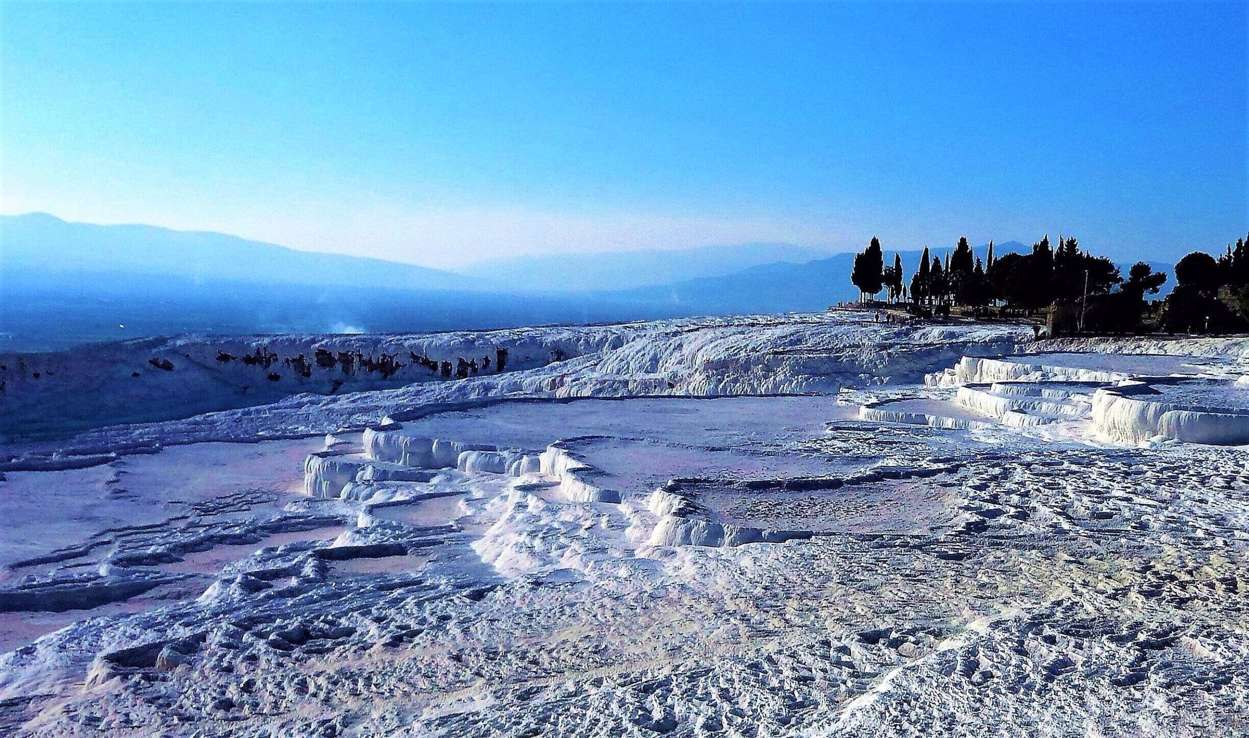 There is quite a surreal feeling to this place. There is a lot of history at #Hierapolis on the same site as #Pamukkale and if you wish to, you can have a walk in the hot springs whilst marvelling at the Travertines made by the carbonate minerals left by the flowing water #Nature
#Mediterranean #Blue #lifeatexpedia #endlesssummer #Unesco #CityIcon #Mountains #BVSBlue  #aboveitall #adventure