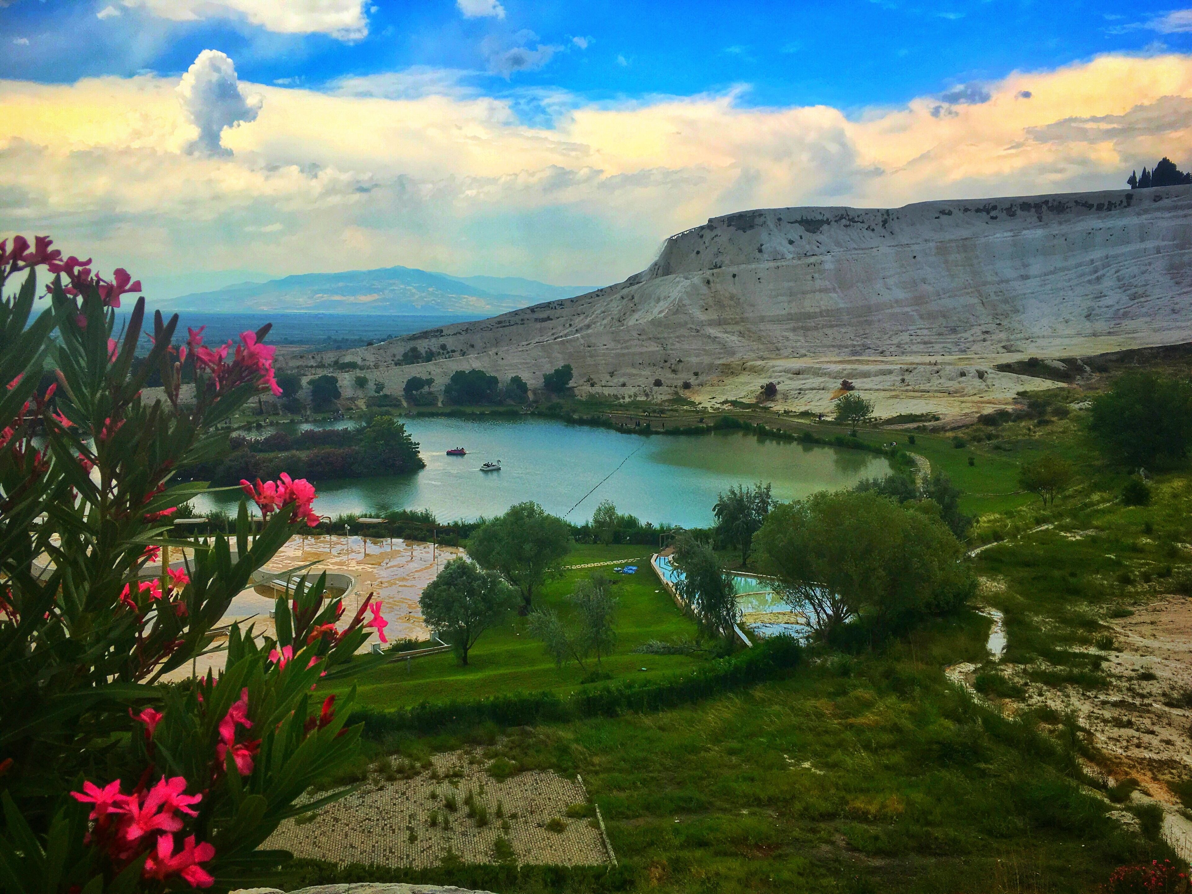 Onsite view of Pamukkale's Travertines. Pamukkale means Cotton Castle. It has white travertine terraces, thermal water & people bathing in calcium pools, and it neighbors Hierapolis the Ancient Roman Spa #pamukkale #pamukkaletravertines #turkey #lifeatexpedia #greatoutdoors #outdoor #trovember