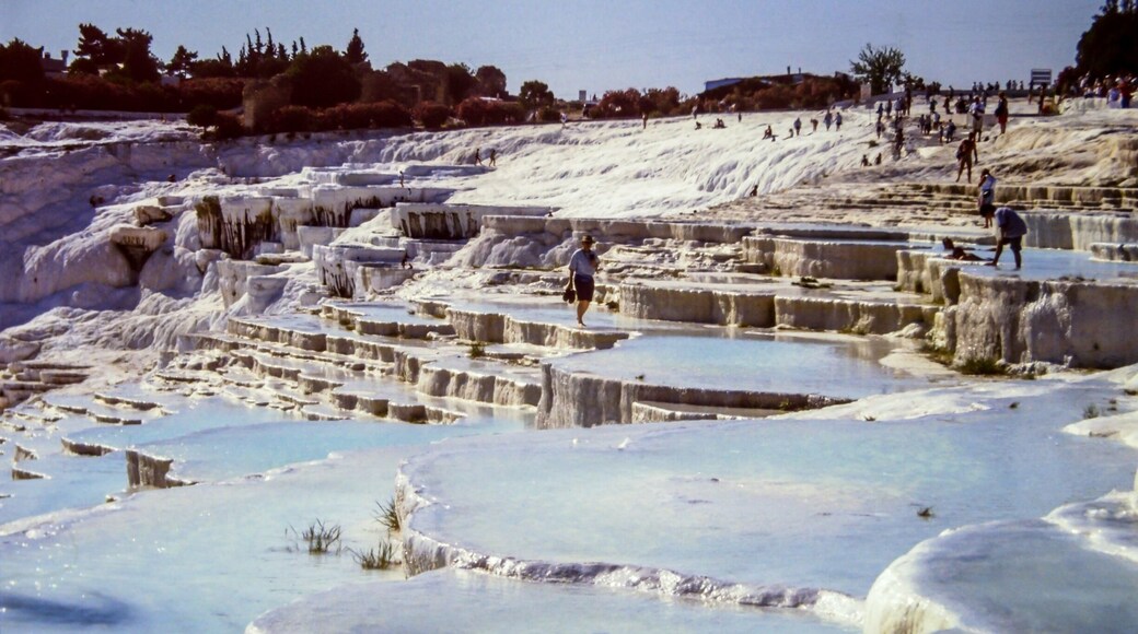 In the early 90 we traveled thru Turkey. On this pictures you'll see the chalk baths of Pamukkale. As you can see in that time you could swim in these baths. That's forbidden these days. When we were there tourism just started in Pamukkale. Now the baths are protected by law.
This picture was taken on a dia positive film wich I digitalised some time ago.
#pamukkale #turkey #asia #europe #white