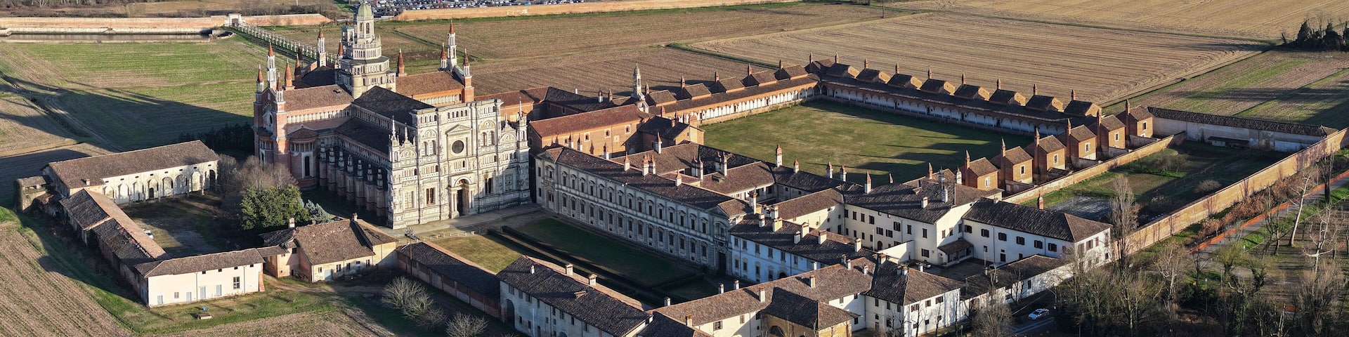 Aerial shot of Certosa di Pavia cathedral a historical monumental complex that includes a monastery and a sanctuary. Pavia ,Italy.