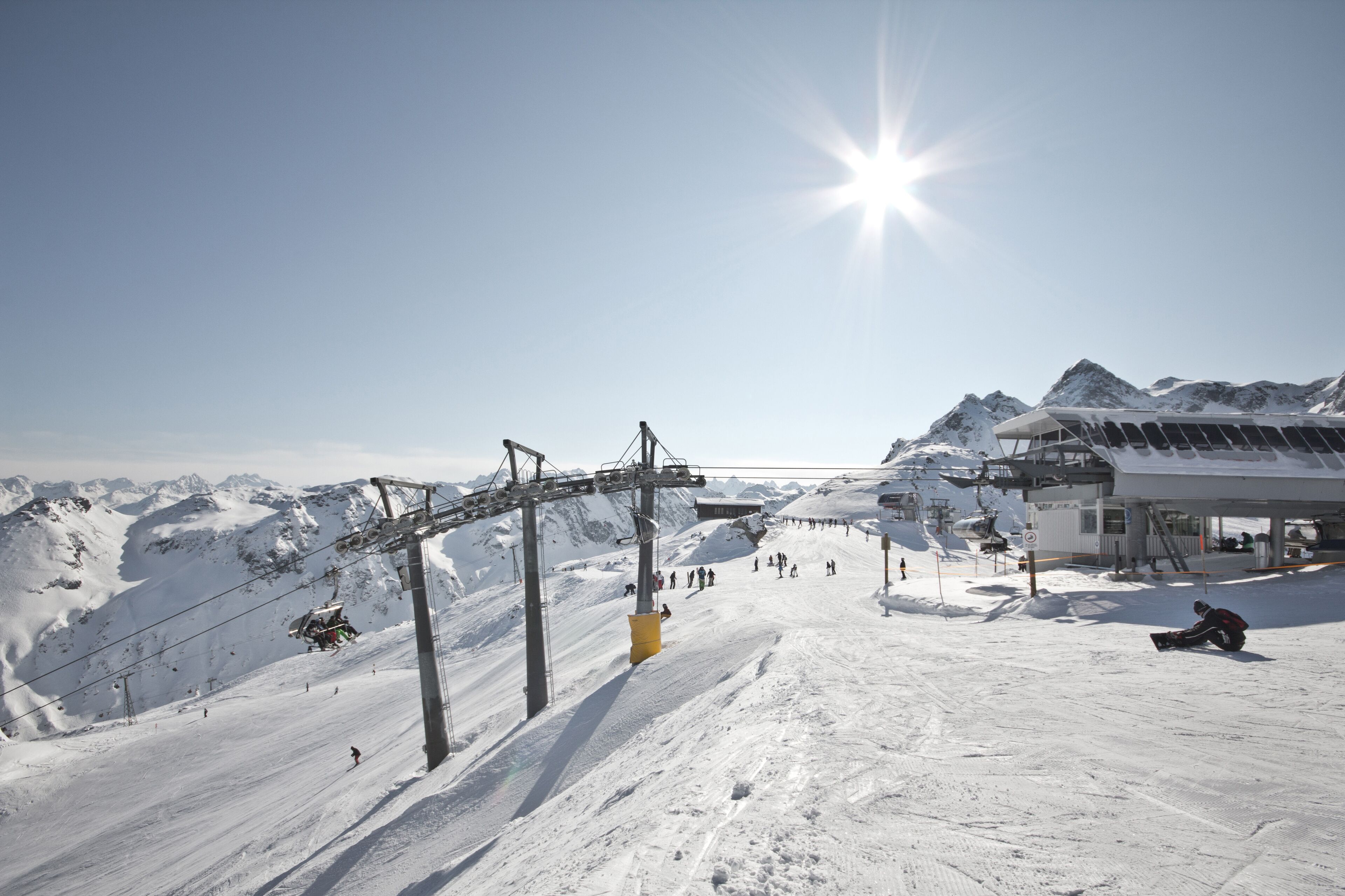 Montafon - Wonderful weather for winter sport action in Austria. Great view over some mountain ranges and peaks in a awesome snow landscape. Snowboarder. Skier.