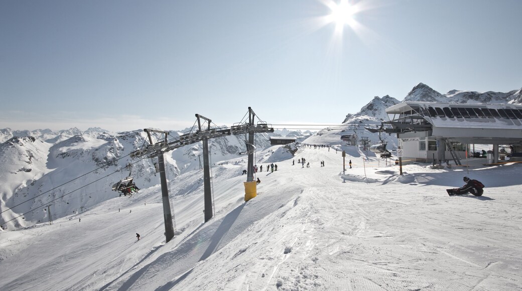 Montafon - Wonderful weather for winter sport action in Austria. Great view over some mountain ranges and peaks in a awesome snow landscape. Snowboarder. Skier.