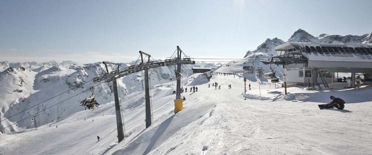 Montafon - Wonderful weather for winter sport action in Austria. Great view over some mountain ranges and peaks in a awesome snow landscape. Snowboarder. Skier.