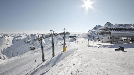 Montafon - Wonderful weather for winter sport action in Austria. Great view over some mountain ranges and peaks in a awesome snow landscape. Snowboarder. Skier.