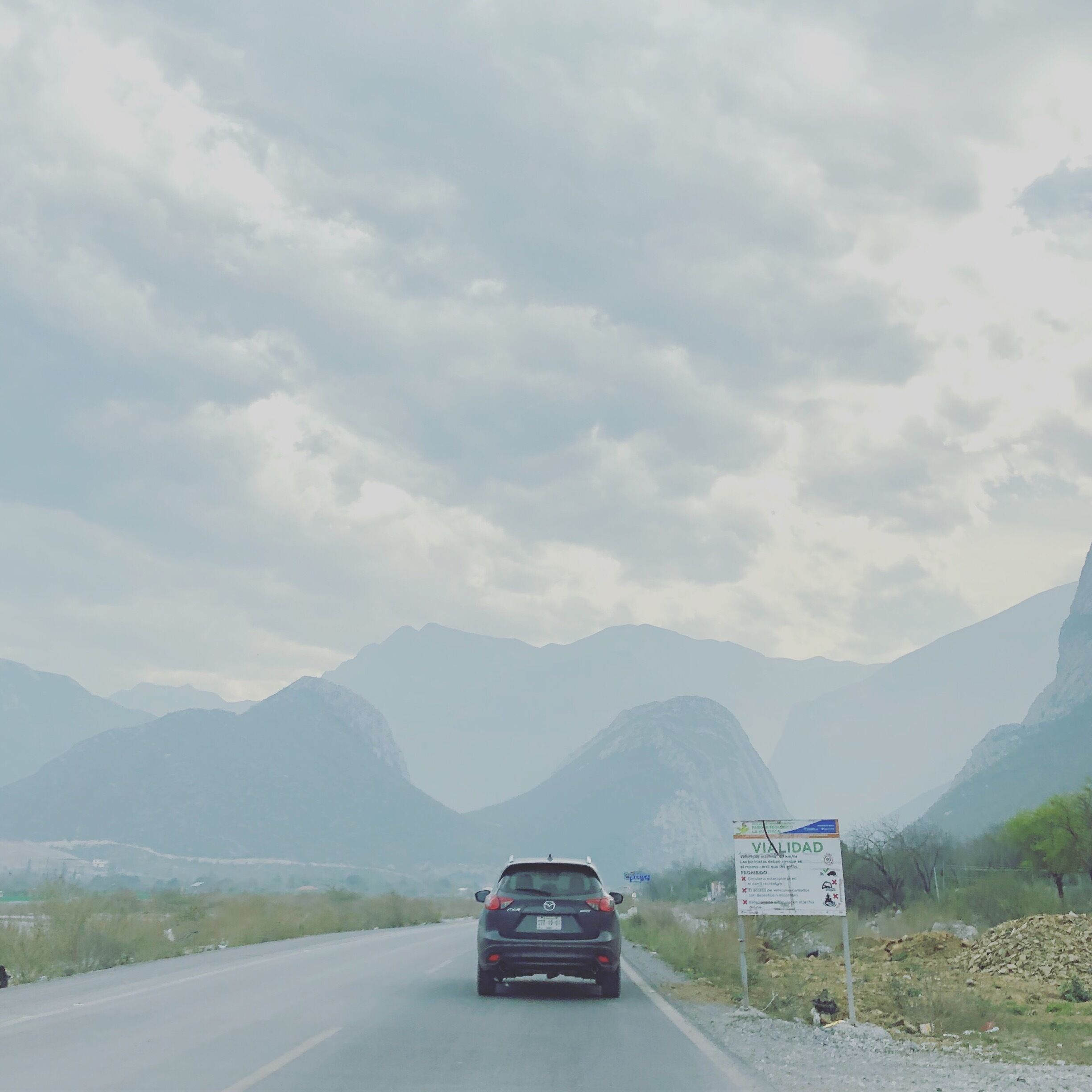 Road trip surrounded by mountains in this atypical cloudy day in Monterrey.