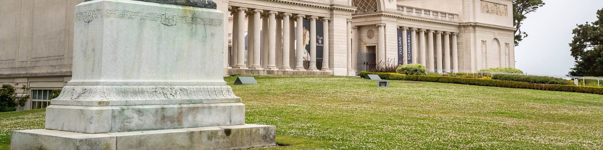 Legion of Honor featuring a garden, a statue or sculpture and heritage architecture
