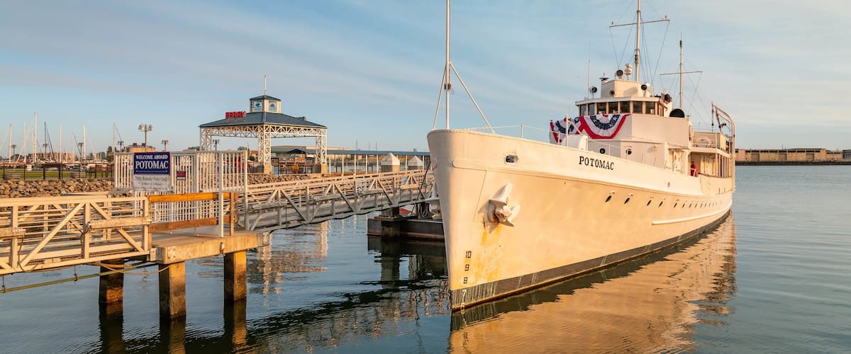 USS Potomac showing a marina and a sunset