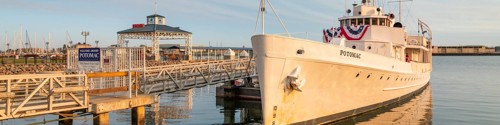 USS Potomac showing a marina and a sunset