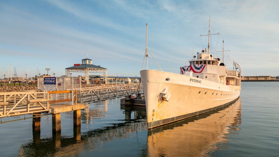 USS Potomac showing a marina and a sunset