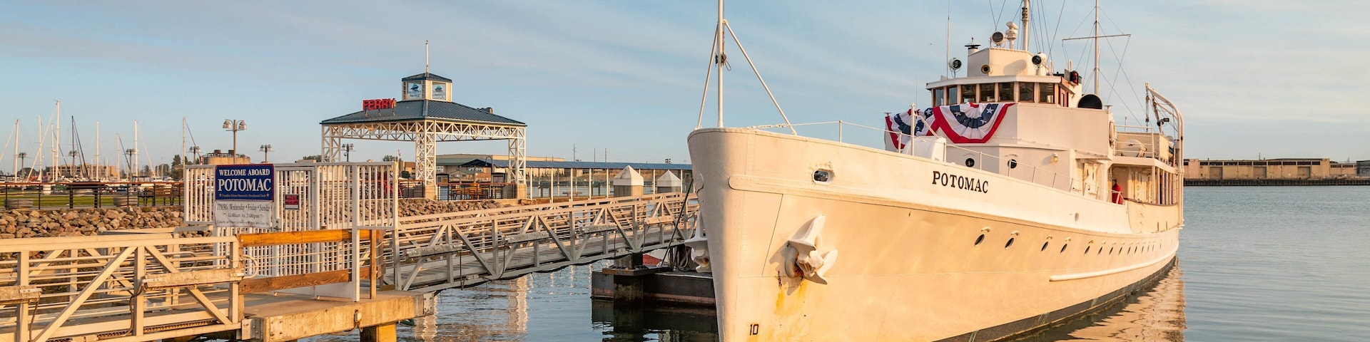 USS Potomac showing a marina and a sunset