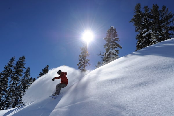 Northstar California Resort featuring snow boarding and snow as well as an individual male