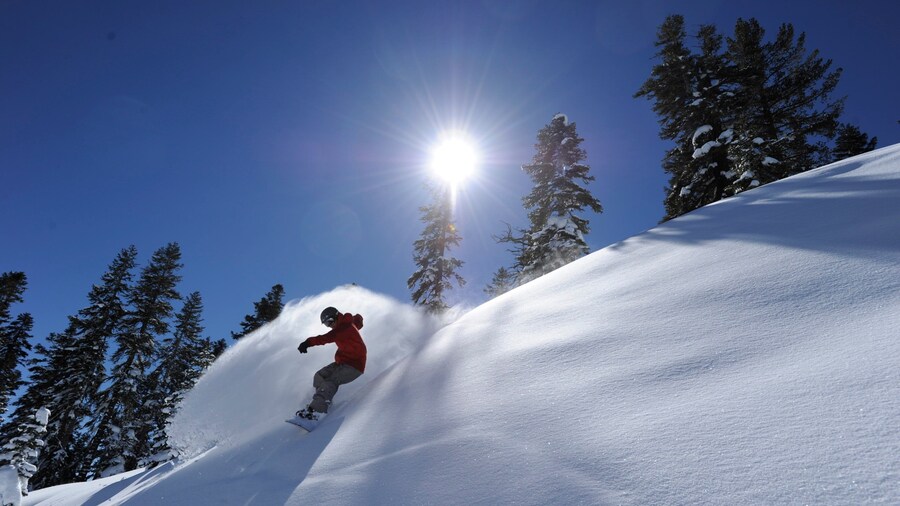 Northstar California Resort featuring snow boarding and snow as well as an individual male