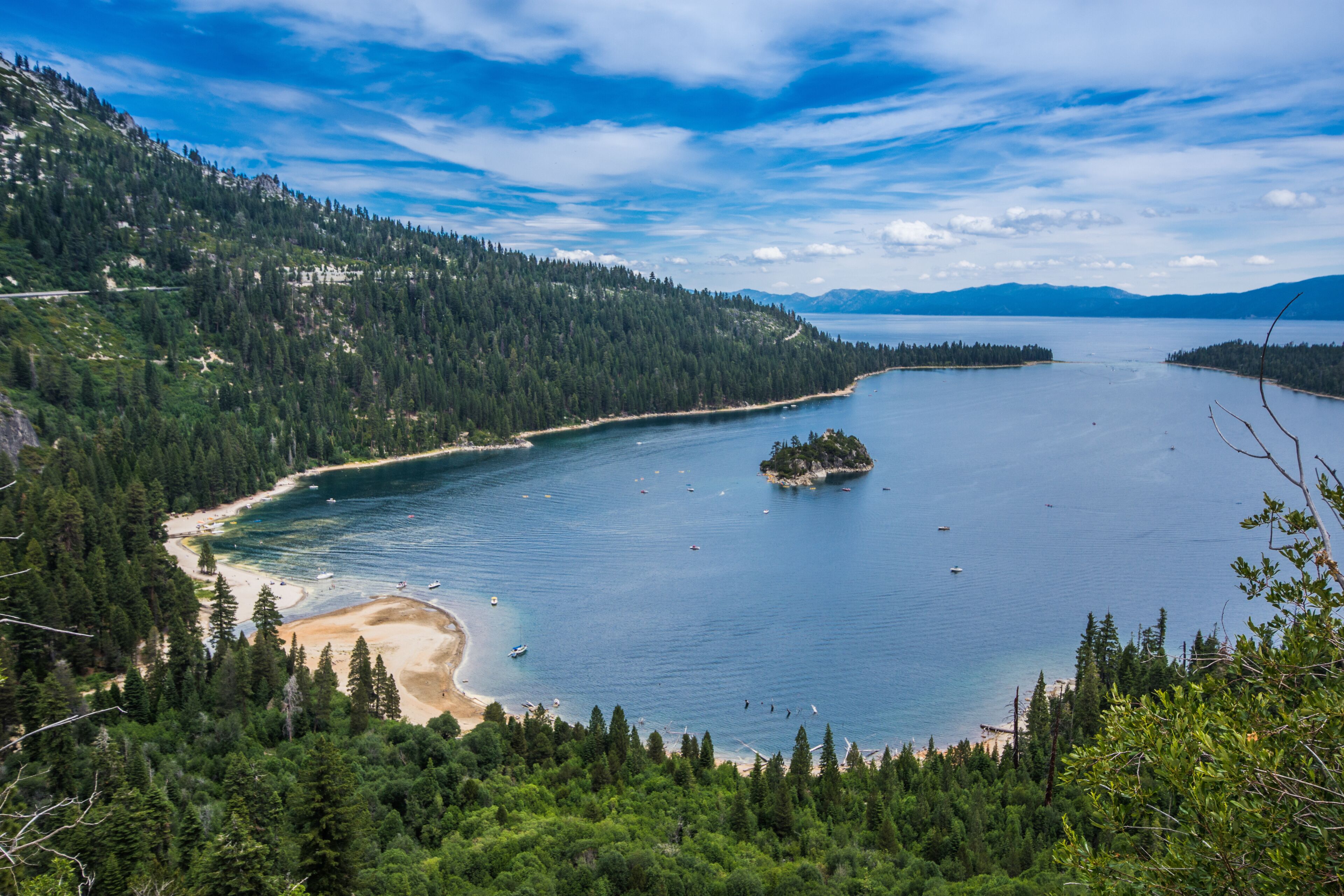 Emerald Bay view with Fannette Island in South Lake Tahoe California in the Sierra Nevada mountains. Sunshine in the summer, boats on the water