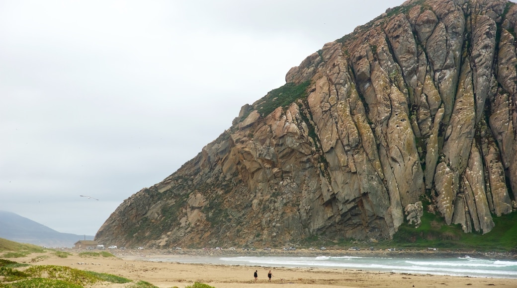 Morro Rock featuring general coastal views, a beach and mountains