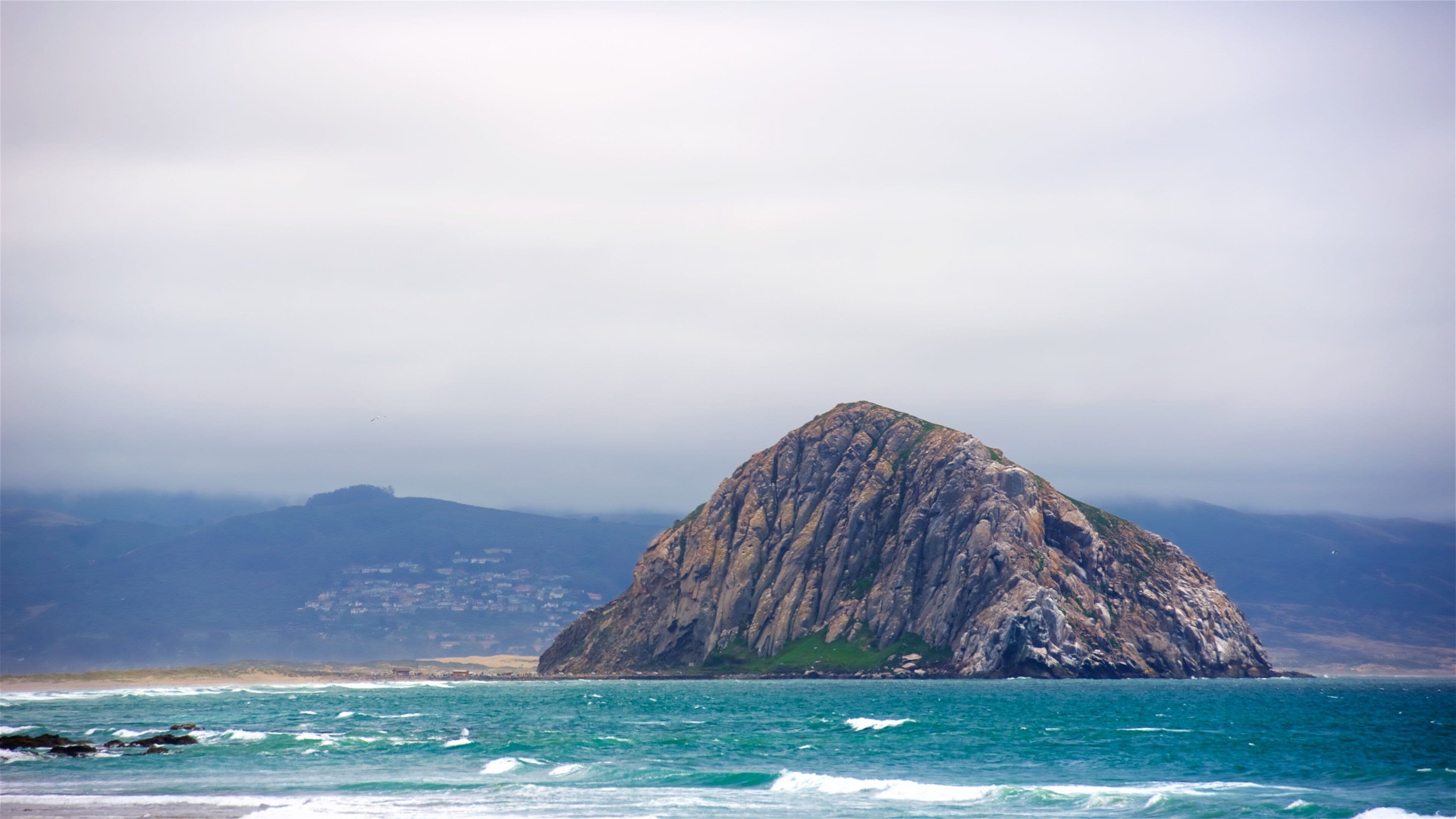 Morro Rock featuring general coastal views and mountains