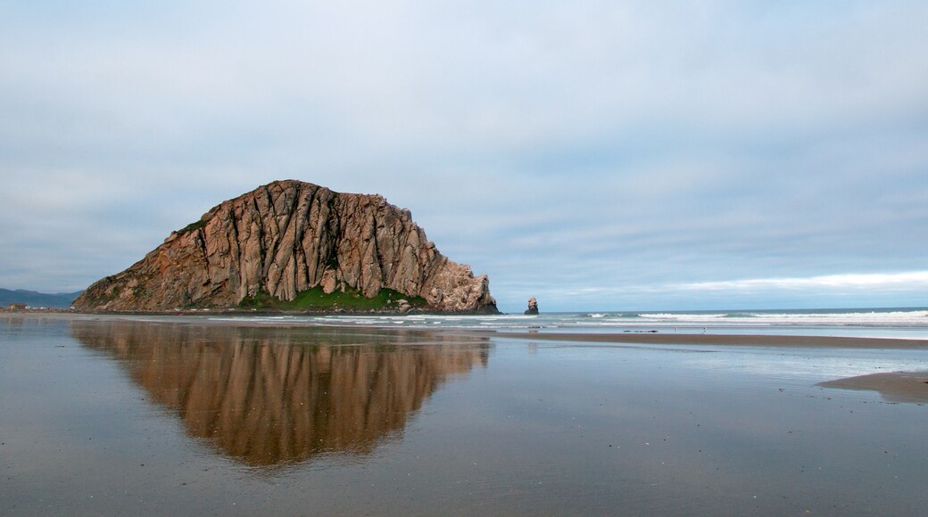 Morro Rock at early morning sunrise at Morro Bay State Park popular vacation / camping spot on the Central California Coast USA