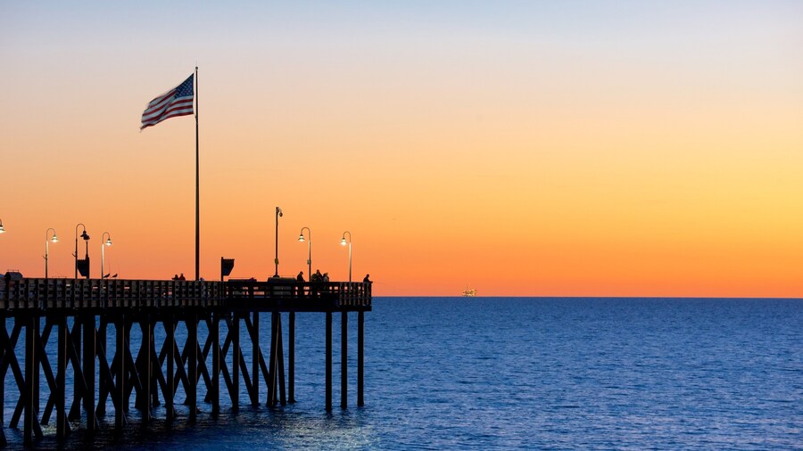 Ventura Pier featuring a sunset and general coastal views