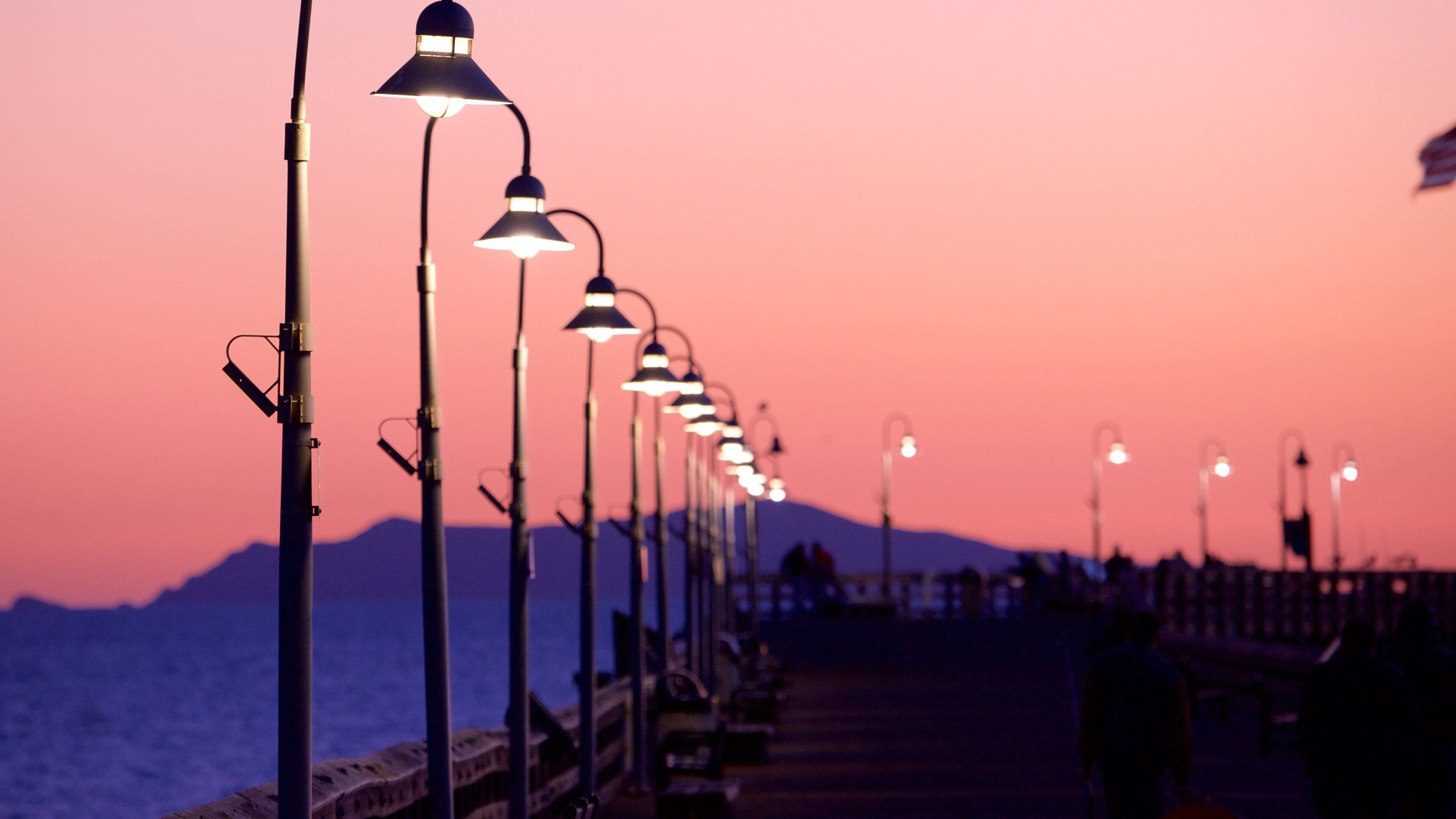 Ventura Pier which includes a sunset and general coastal views