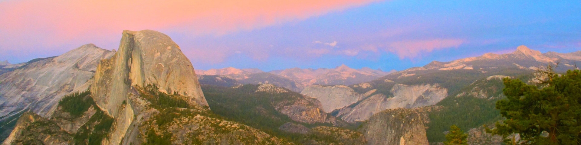 Yosemite Valley showing a gorge or canyon, a sunset and mountains