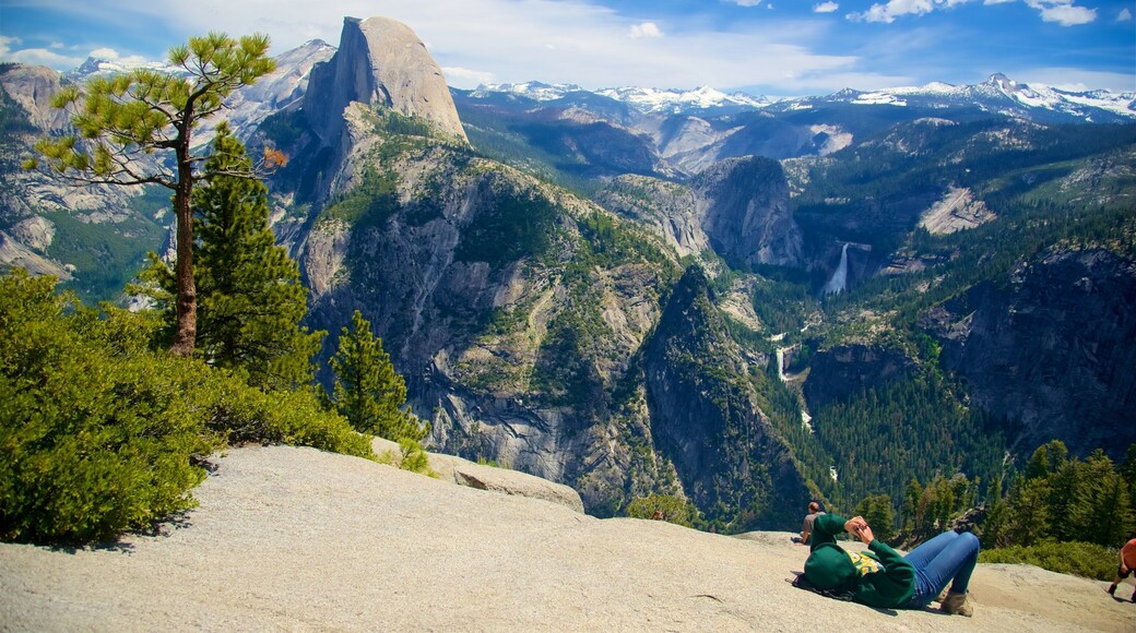 Glacier Point which includes mountains and landscape views as well as a small group of people