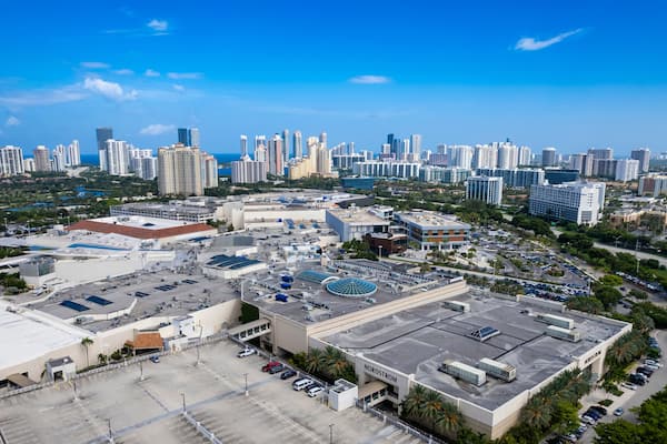 Aventura, Florida, USA - Aerial of Aventura Mall, with skyline of Sunny Isles Beach in the distance.