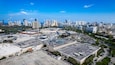 Aventura, Florida, USA - Aerial of Aventura Mall, with skyline of Sunny Isles Beach in the distance.