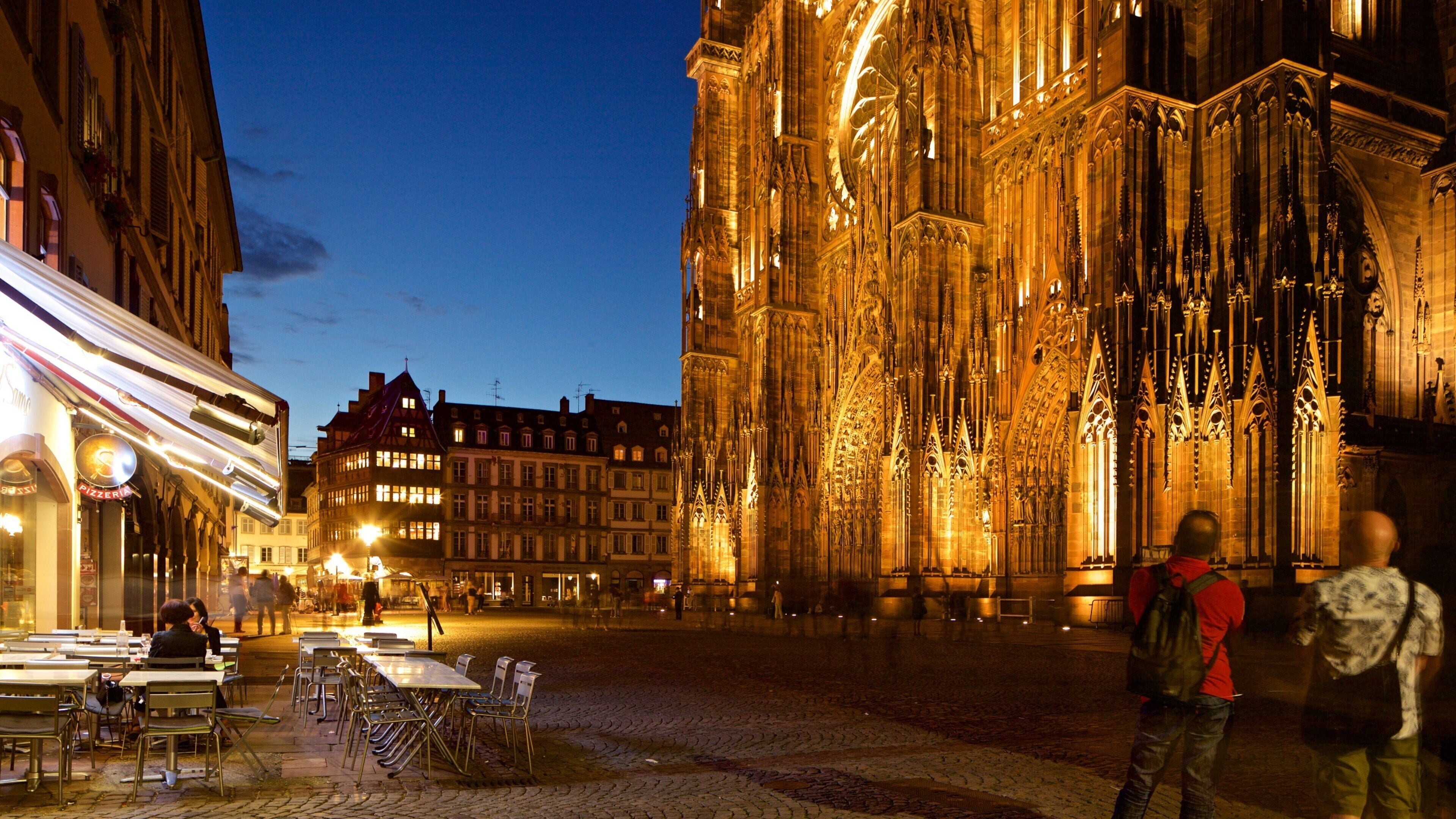 Our Lady of Strasbourg Cathedral which includes night scenes, a church or cathedral and heritage architecture