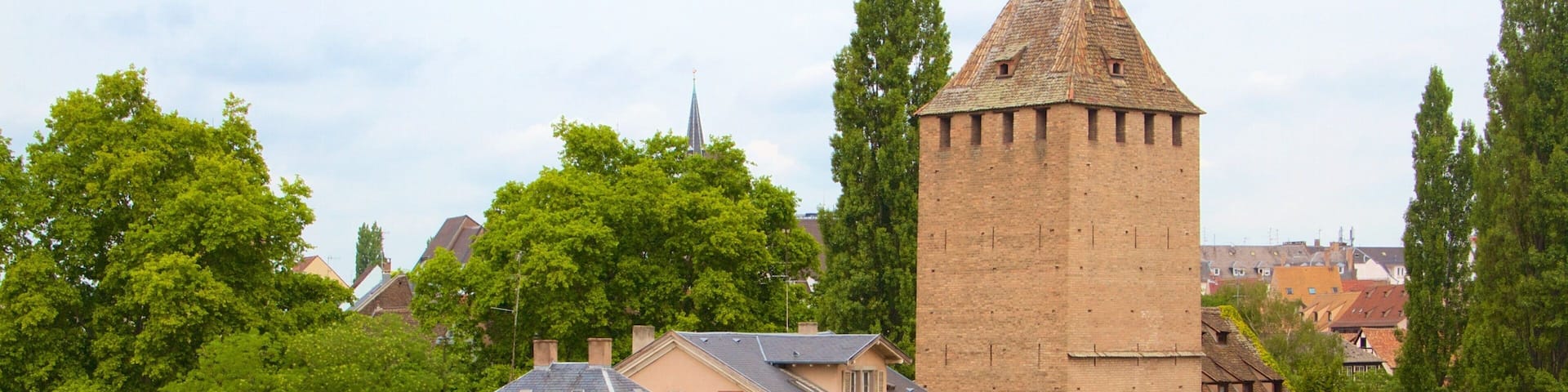 Covered Bridge showing a bridge, a river or creek and a small town or village